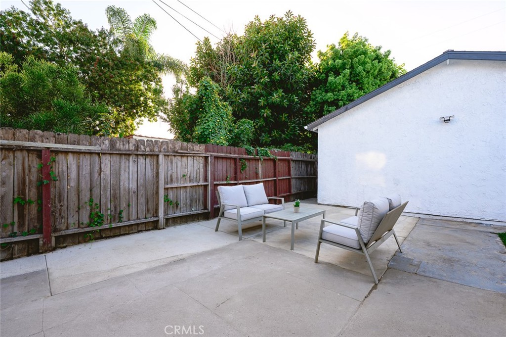 1065 Bennett Avenue Long Beach, CA 90804 - Photo 3 of 44 a view of backyard with outdoor seating and trees
