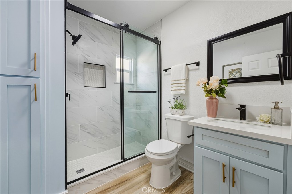 1065 Bennett Avenue Long Beach, CA 90804 - Photo 31 of 44 a bathroom with a sink toilet and shower