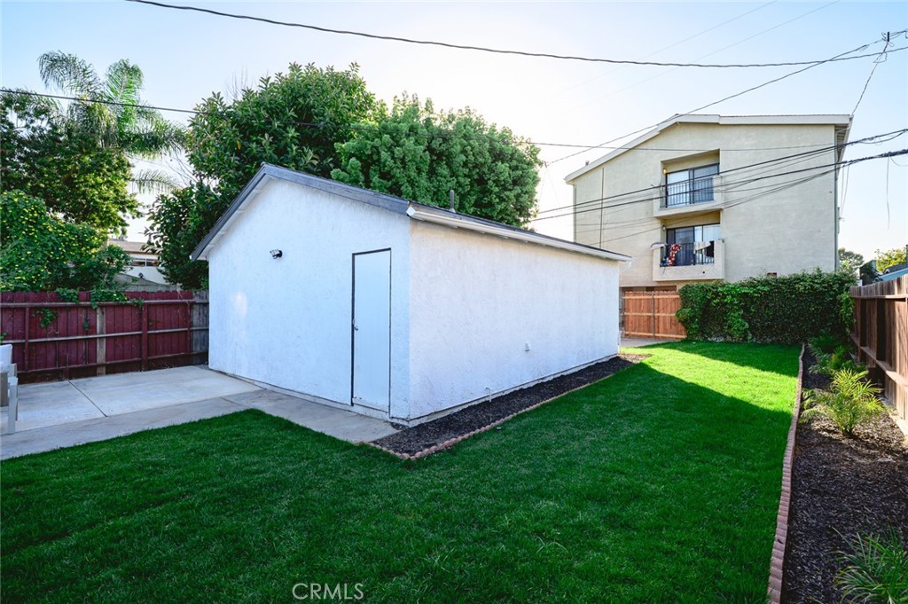 1065 Bennett Avenue Long Beach, CA 90804 - Photo 6 of 44 a view of backyard of house with wooden fence