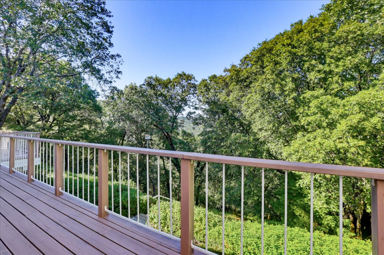 18639 Fay Ridge Court Grass Valley, CA 95949 - Photo 61 of 99 a balcony with trees in front of it