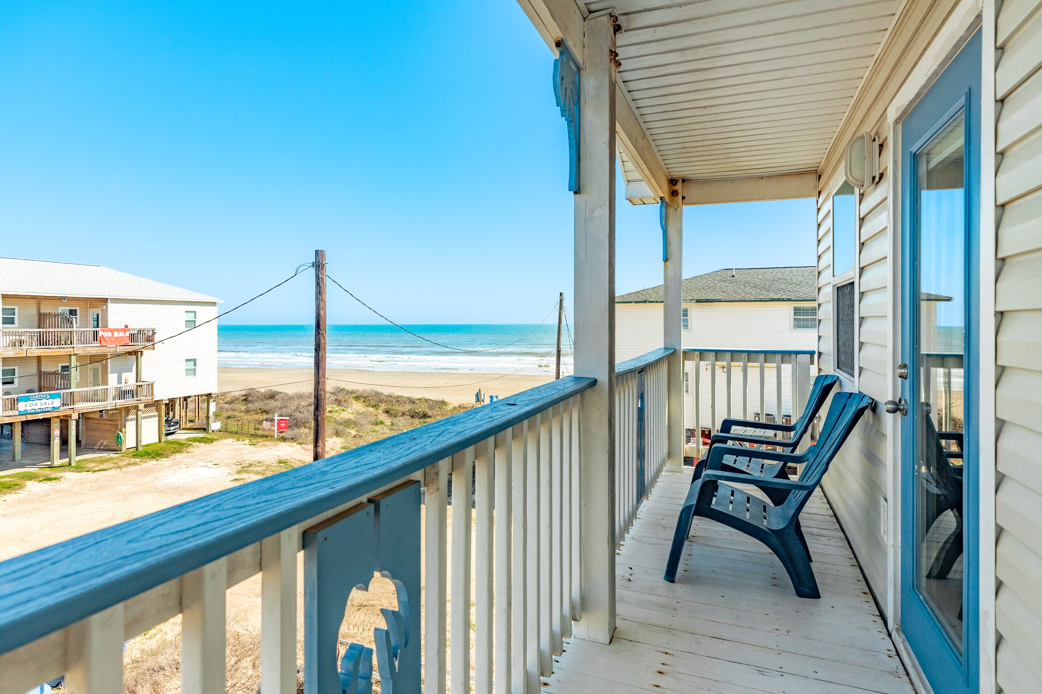 107 Howard Avenue Surfside Beach, TX 77541 - Photo 3 of 38 Covered outdoor retreat with multiple seating options, ideal for gathering or unwinding after a day on the beach.