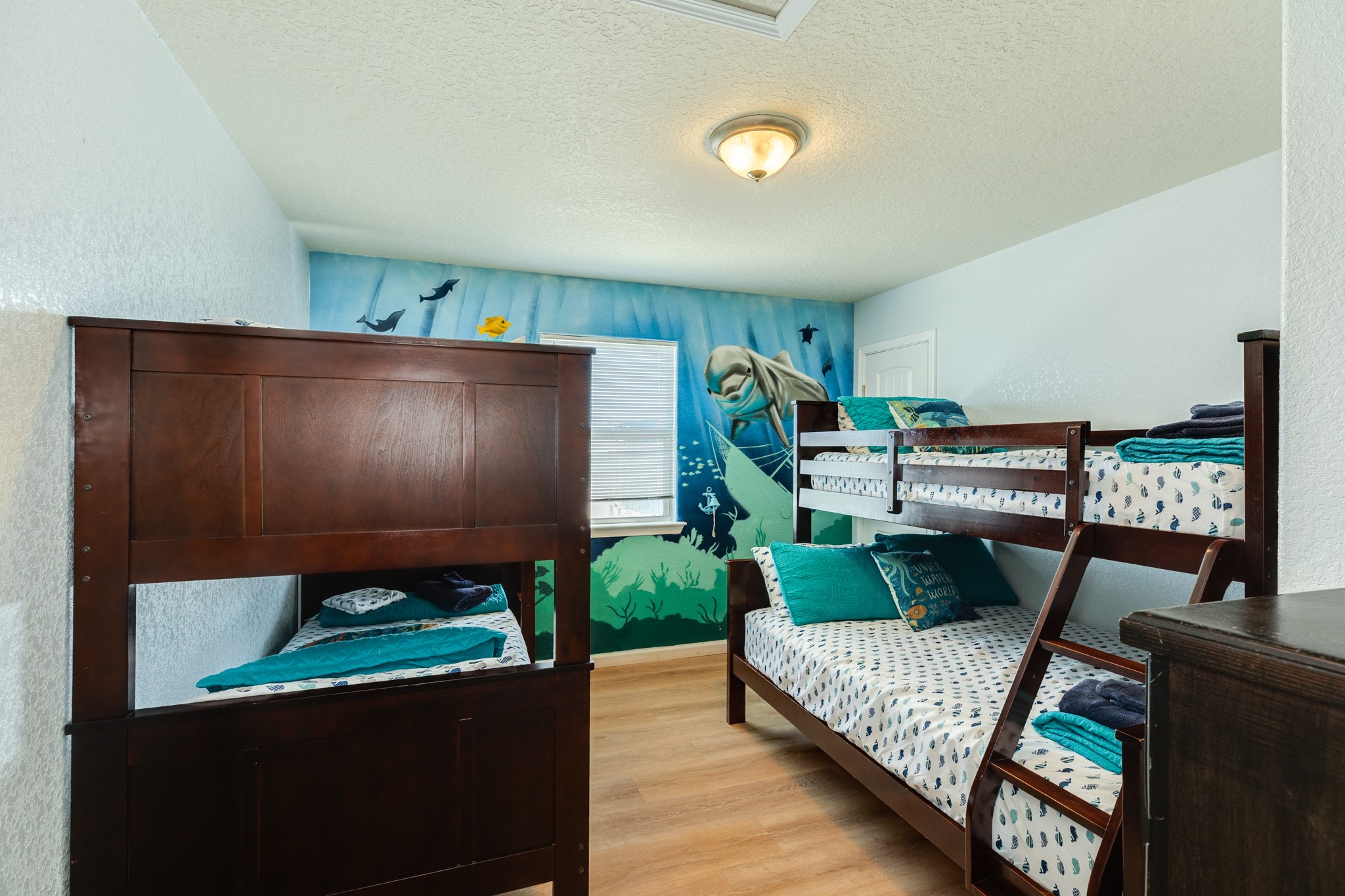 107 Howard Avenue Surfside Beach, TX 77541 - Photo 33 of 38 Fun and functional bunk room with multiple sleeping spaces, perfect for hosting guests or maximizing accommodations.