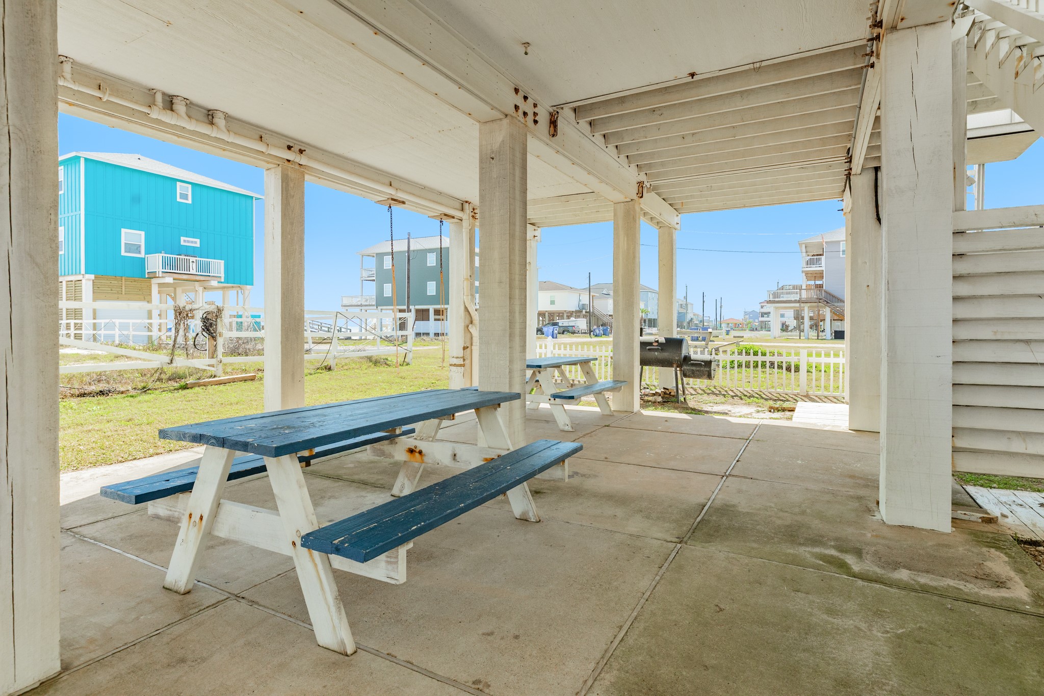 107 Howard Avenue Surfside Beach, TX 77541 - Photo 35 of 38 Concrete slab patio under the home provides ample room for seating, dining, and outdoor enjoyment year-round.