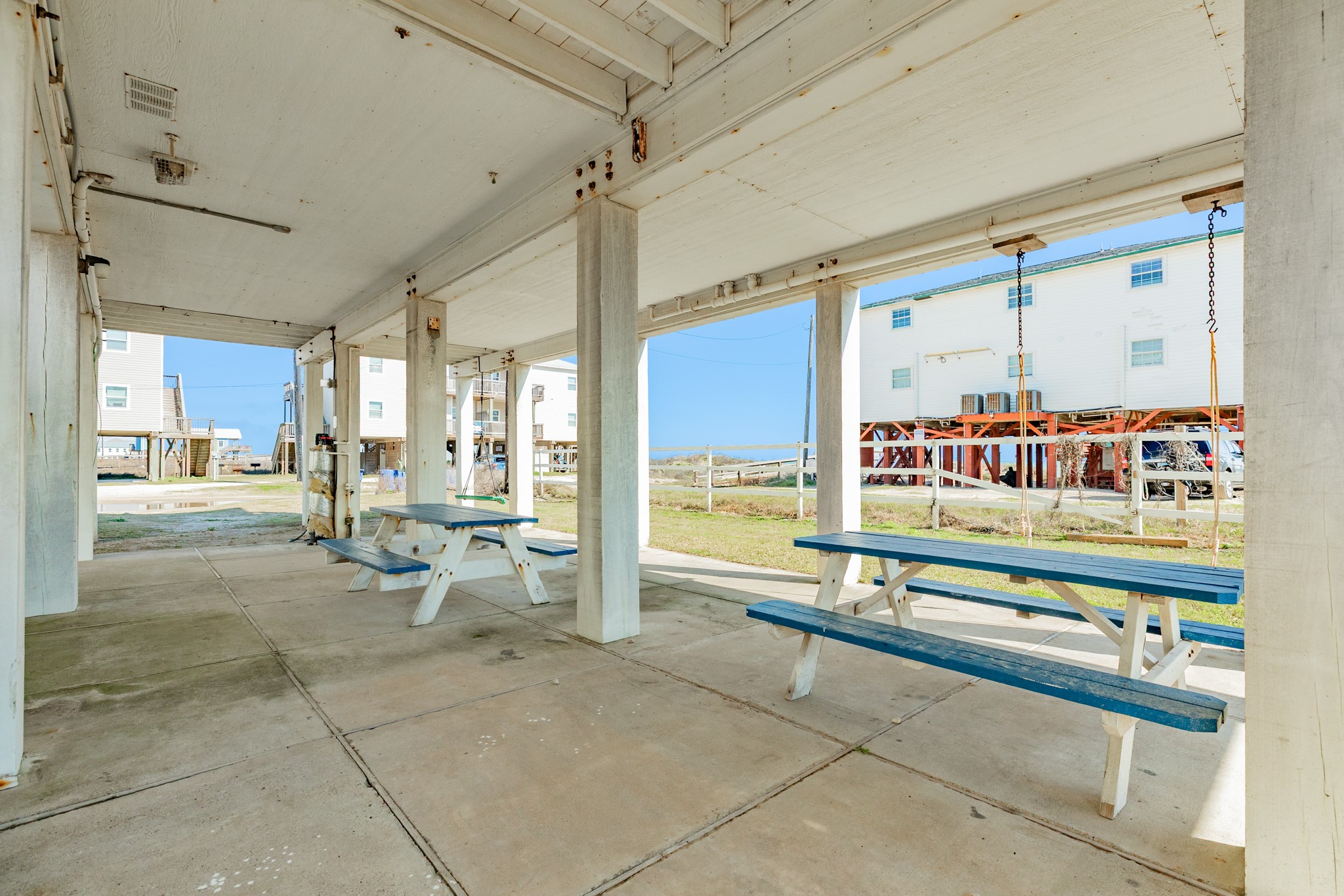 107 Howard Avenue Surfside Beach, TX 77541 - Photo 36 of 38 Concrete slab patio under the home provides ample room for seating, dining, and outdoor enjoyment year-round.