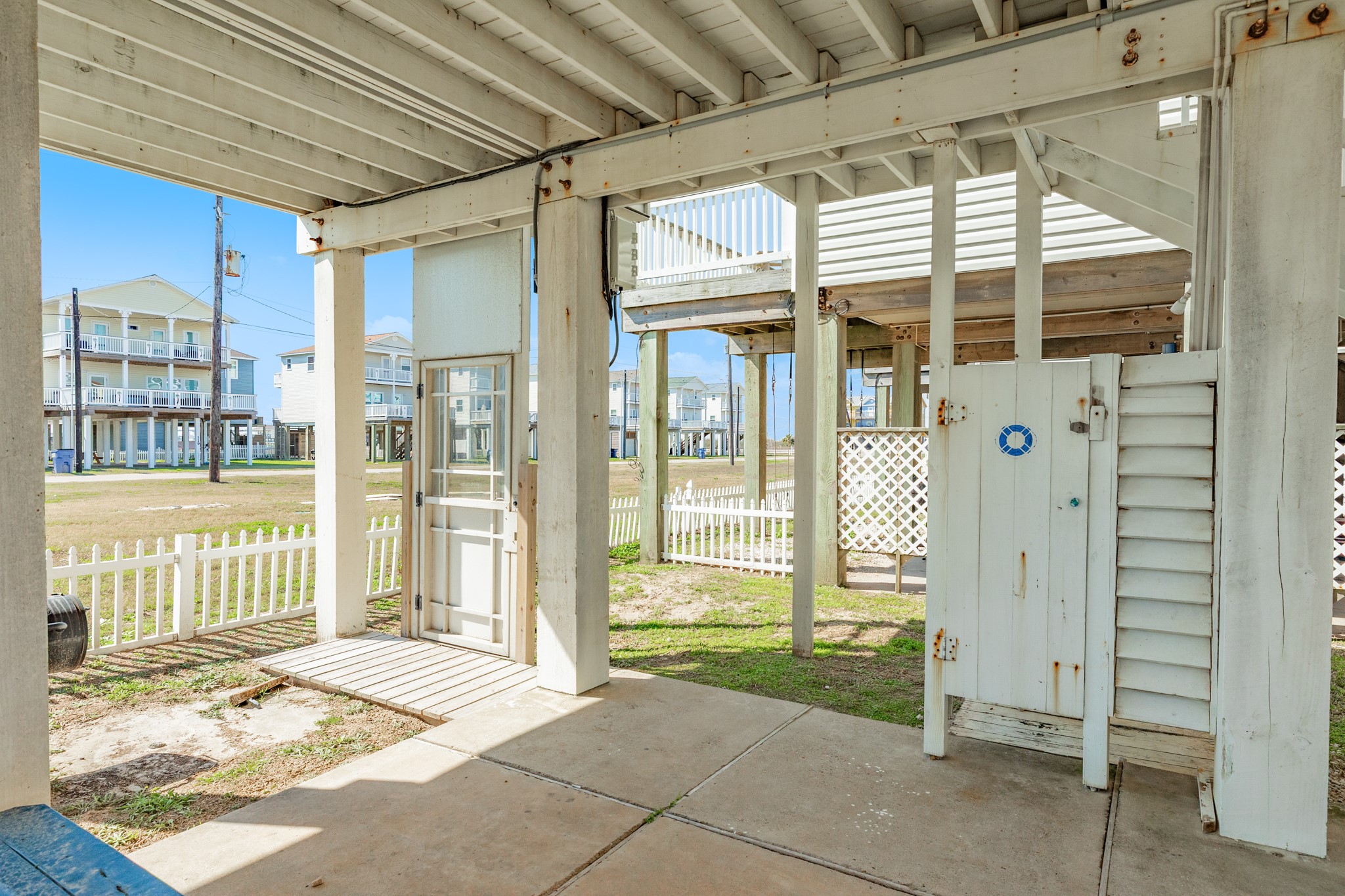 107 Howard Avenue Surfside Beach, TX 77541 - Photo 37 of 38 Convenient outdoor shower and storage space, perfect for rinsing off after a day at the beach.
