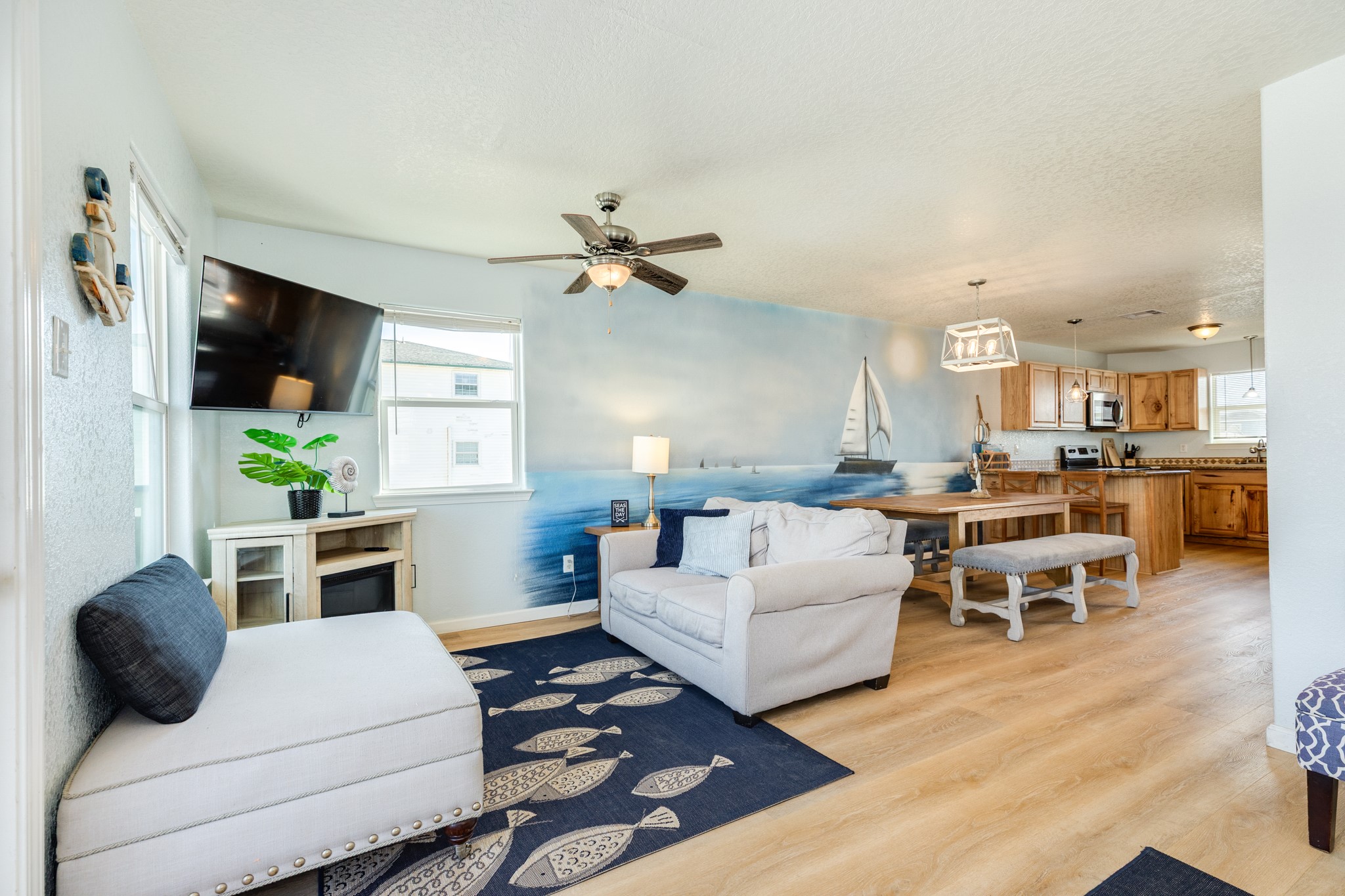 107 Howard Avenue Surfside Beach, TX 77541 - Photo 4 of 38 Spacious open-concept layout connecting the living room to the dining area and kitchen, ideal for gathering and entertaining.