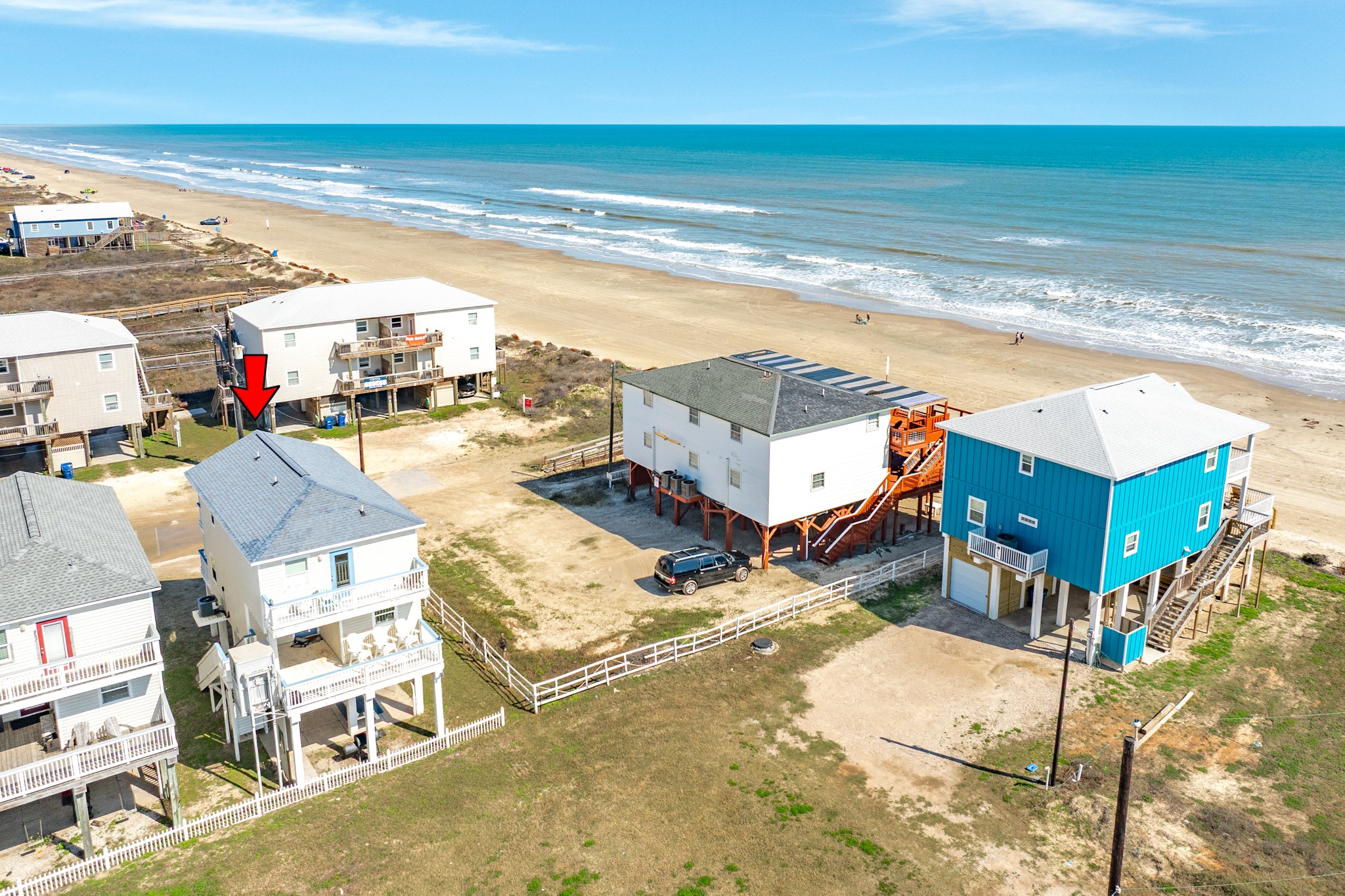 107 Howard Avenue Surfside Beach, TX 77541 - Photo 10 of 38 Prime location along a stretch of beachfront homes with sweeping shoreline views and easy access to the water.