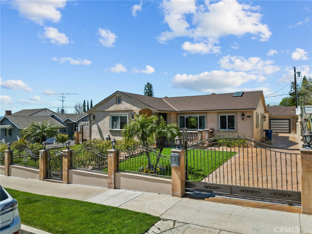 931 University Avenue Burbank, CA 91504 - Photo 1 of 49 a front view of a house with a garden and deck