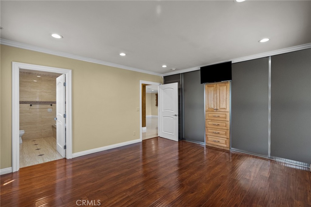 931 University Avenue Burbank, CA 91504 - Photo 23 of 49 a view of an empty room with wooden floor and a window