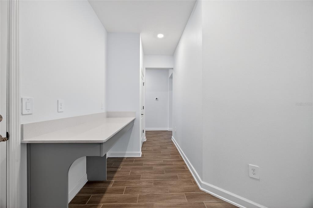 11128 Lore Way Orlando, FL 32832 - Photo 21 of 79 a view of a hallway with wooden floor