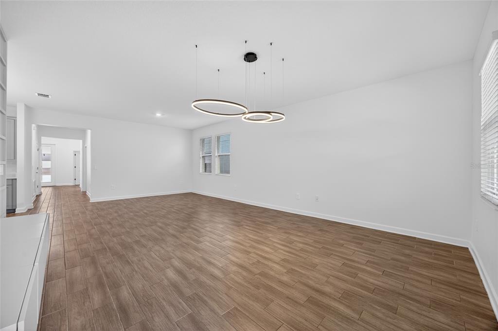 11128 Lore Way Orlando, FL 32832 - Photo 30 of 79 a view of empty room with wooden floor