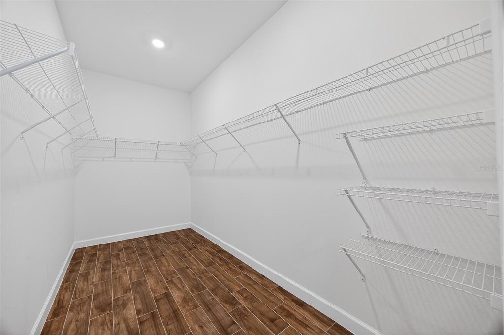 11128 Lore Way Orlando, FL 32832 - Photo 52 of 79 a view of a room with racks on the wall