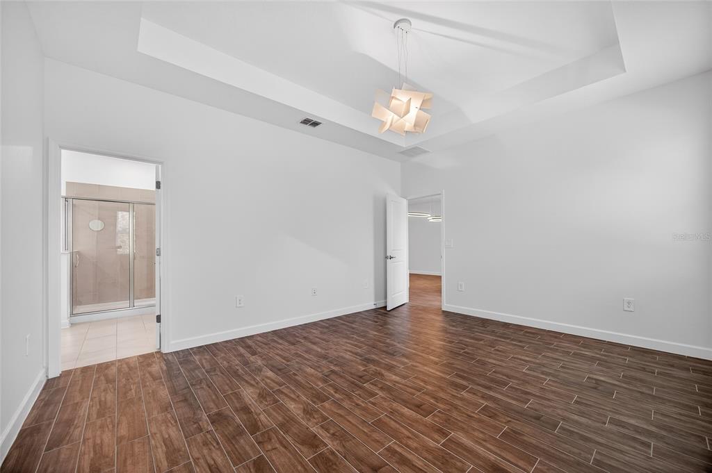 11128 Lore Way Orlando, FL 32832 - Photo 53 of 79 wooden floor in an empty room