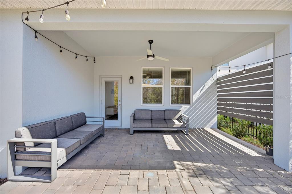 11128 Lore Way Orlando, FL 32832 - Photo 57 of 79 a living room with furniture and a fireplace