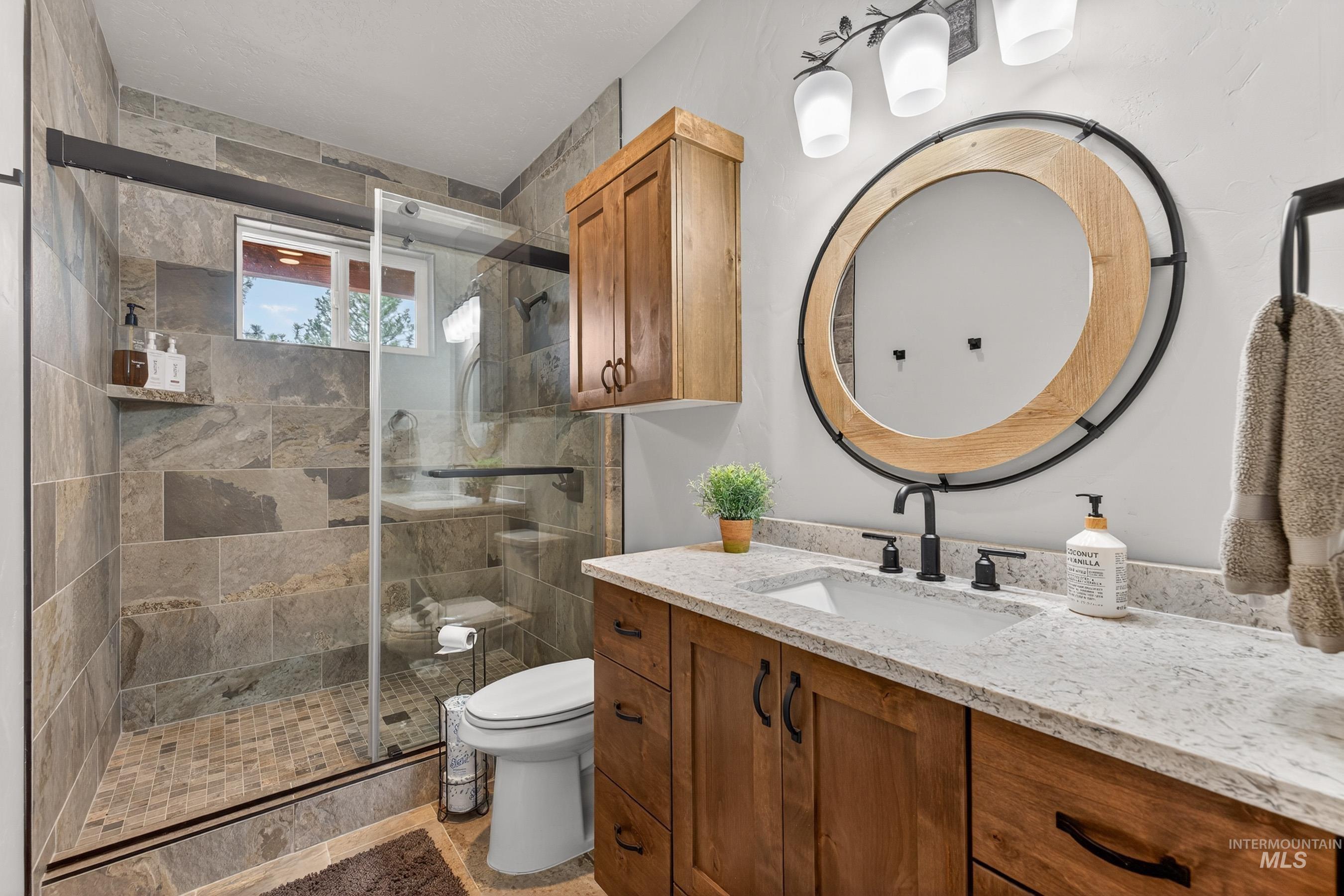 10191 Timberrim Drive Cascade, ID 83611 - Photo 23 of 44 Full bathroom with vanity and a shower stall