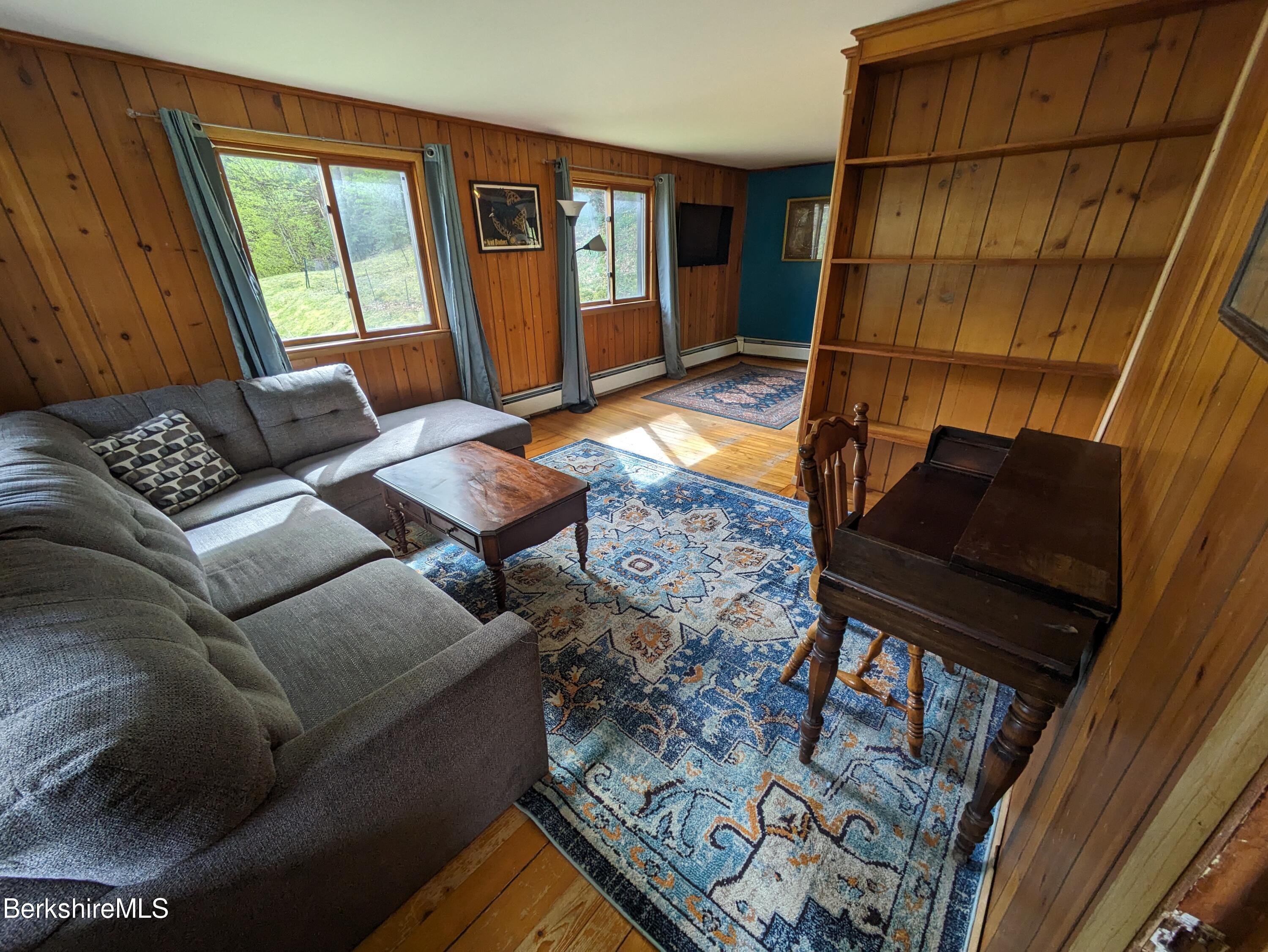 480 River Road Clarksburg, MA 01247 - Photo 8 of 44 a living room with furniture and a window