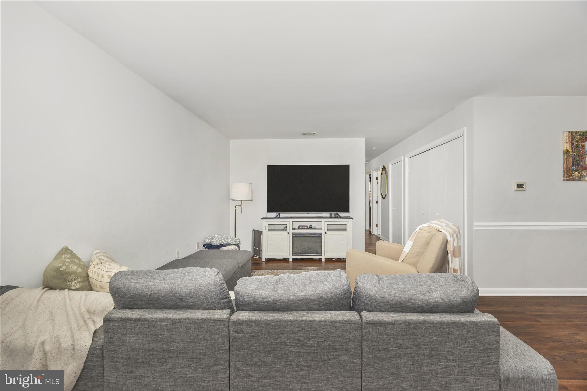 439 Center Street Frederick, MD 21701 - Photo 11 of 49 a living room with furniture and a flat screen tv