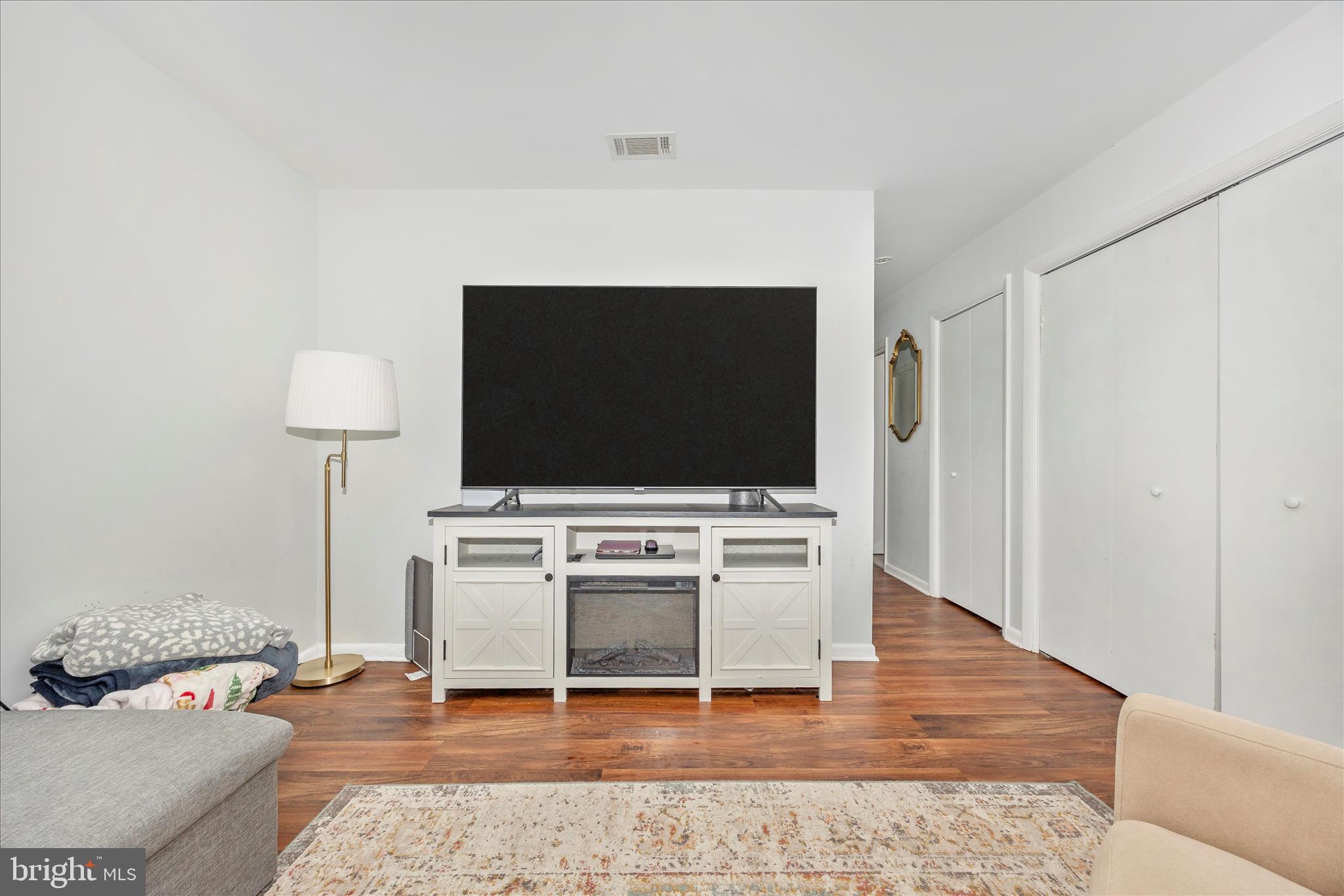 439 Center Street Frederick, MD 21701 - Photo 13 of 49 a living room with furniture and a flat screen tv
