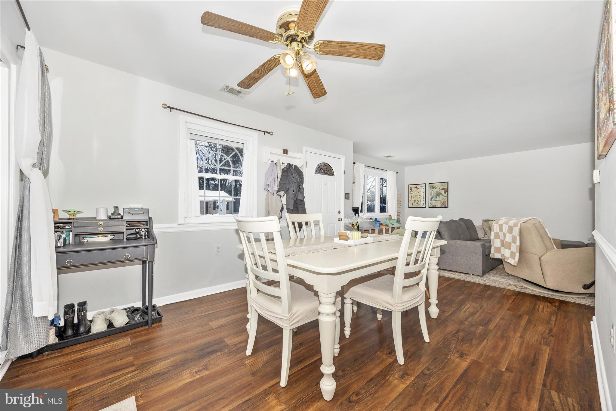 439 Center Street Frederick, MD 21701 - Photo 18 of 49 a view of a dining room with furniture wooden floor and a chandelier fan