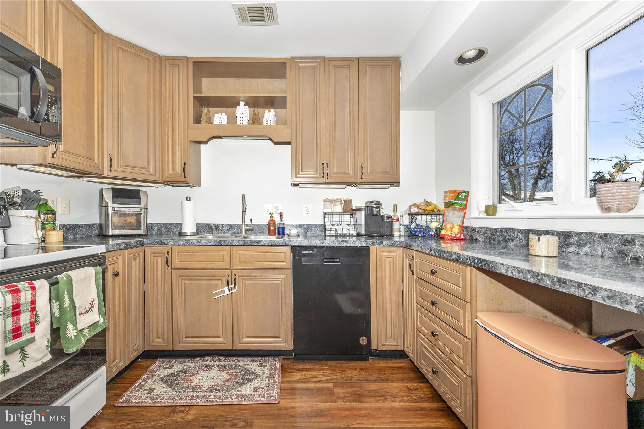 439 Center Street Frederick, MD 21701 - Photo 20 of 49 a kitchen with granite countertop a sink stainless steel appliances and cabinets