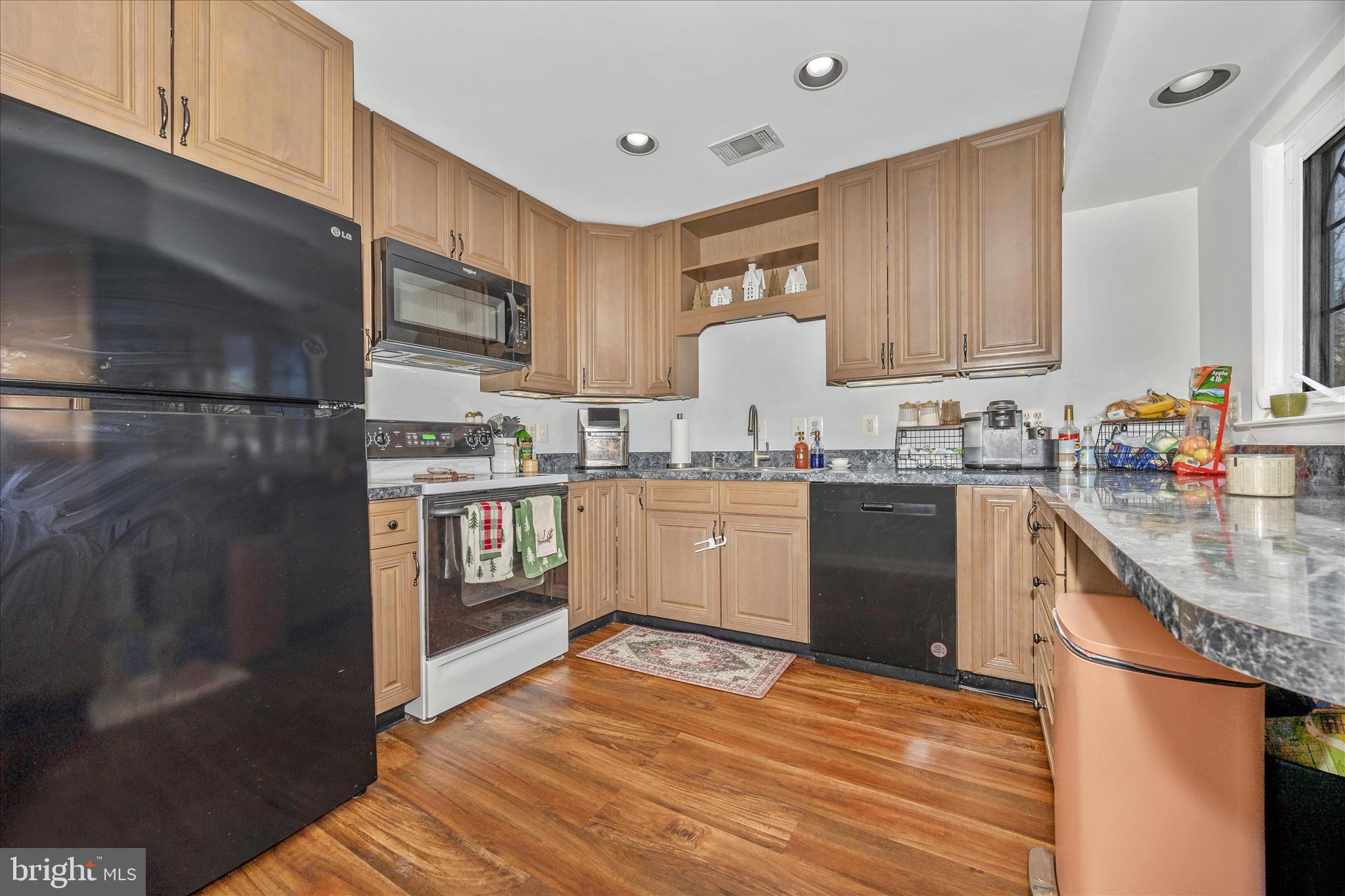 439 Center Street Frederick, MD 21701 - Photo 21 of 49 a kitchen with stainless steel appliances granite countertop a sink stove and refrigerator