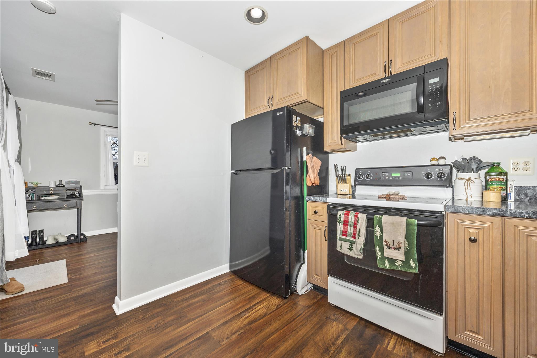 439 Center Street Frederick, MD 21701 - Photo 24 of 49 a kitchen with stainless steel appliances a stove a microwave and a refrigerator