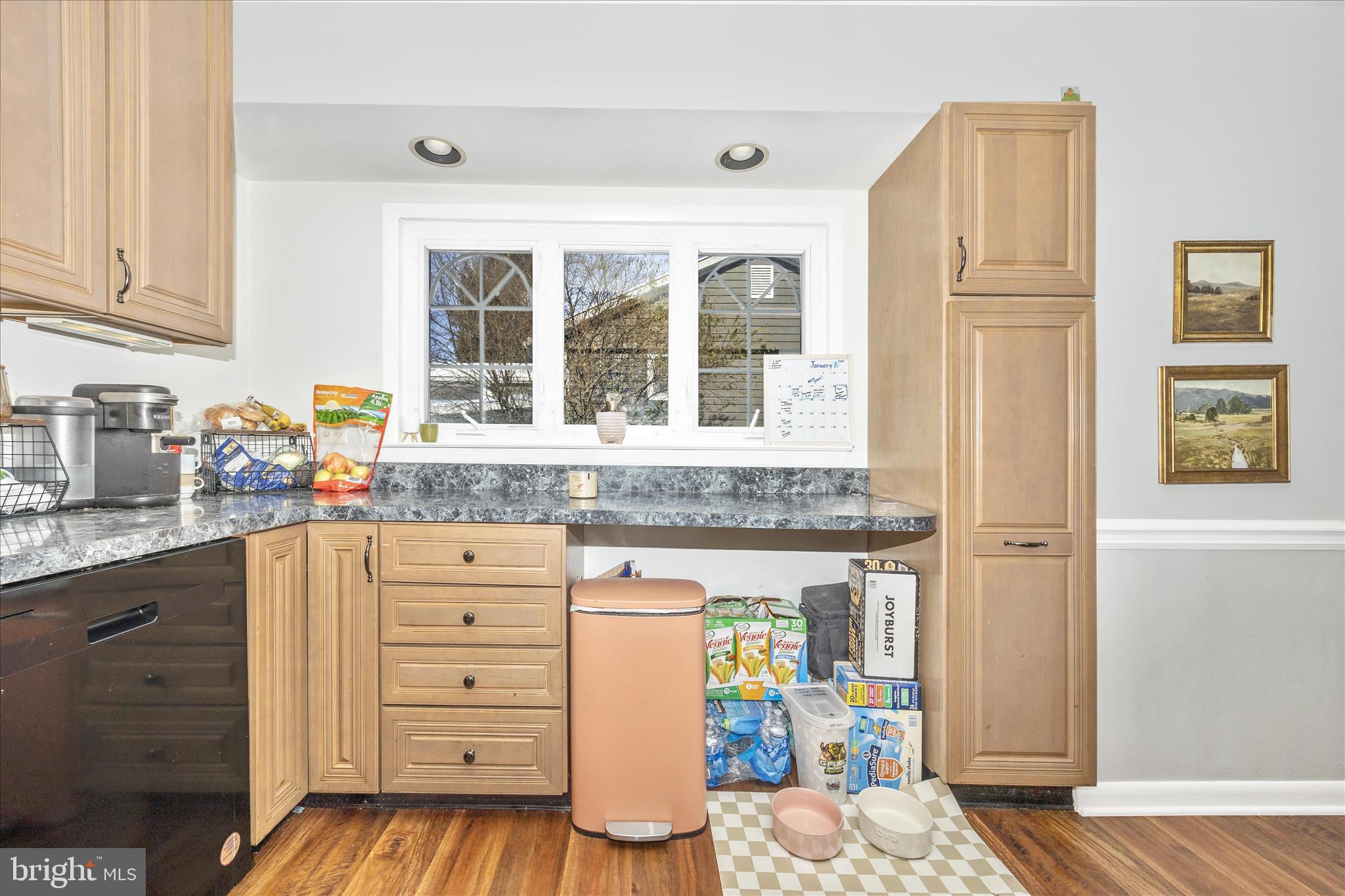 439 Center Street Frederick, MD 21701 - Photo 26 of 49 a kitchen with cabinets appliances and a wooden floor