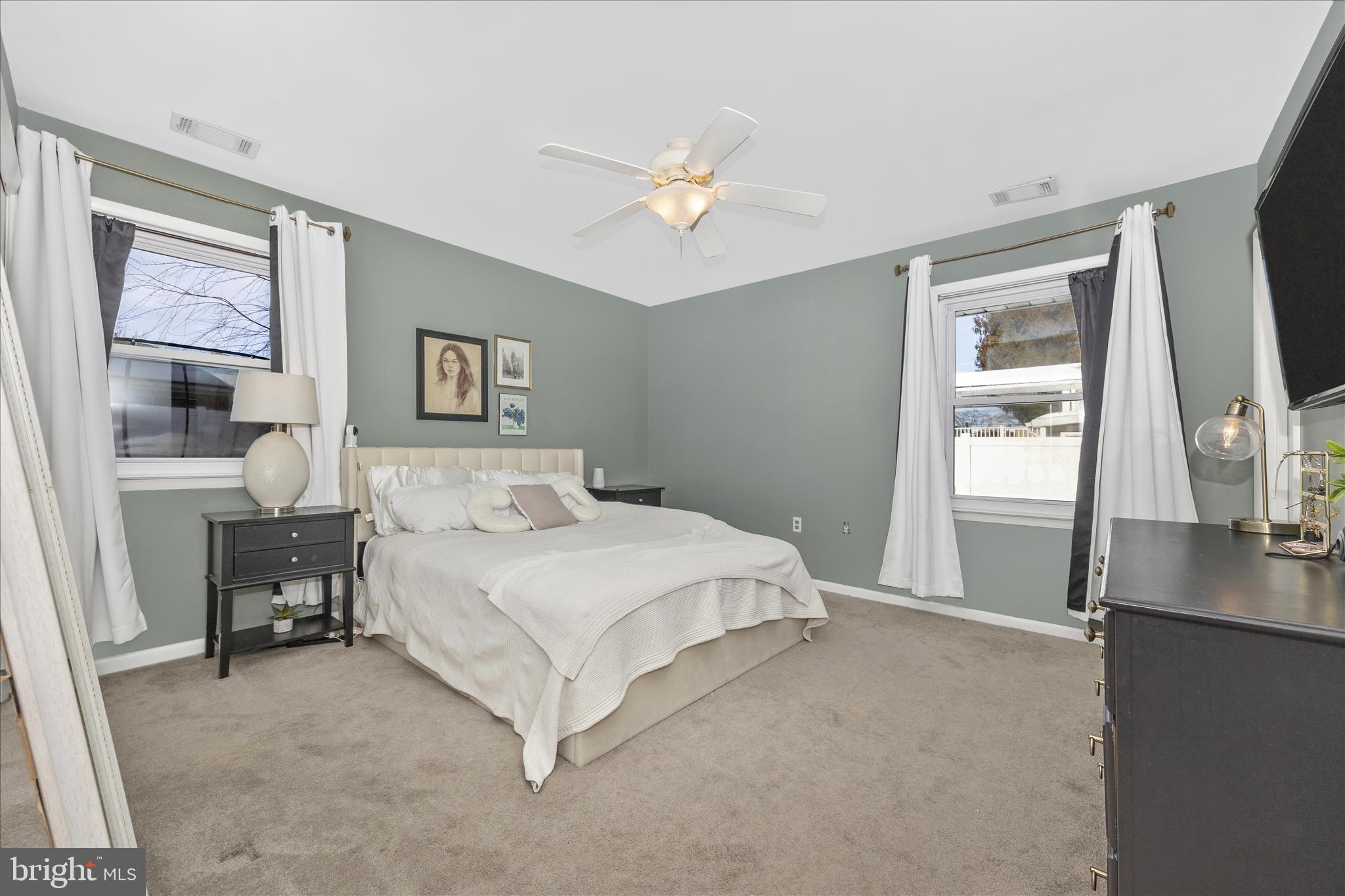 439 Center Street Frederick, MD 21701 - Photo 28 of 49 a spacious bedroom with a bed and a flat screen tv