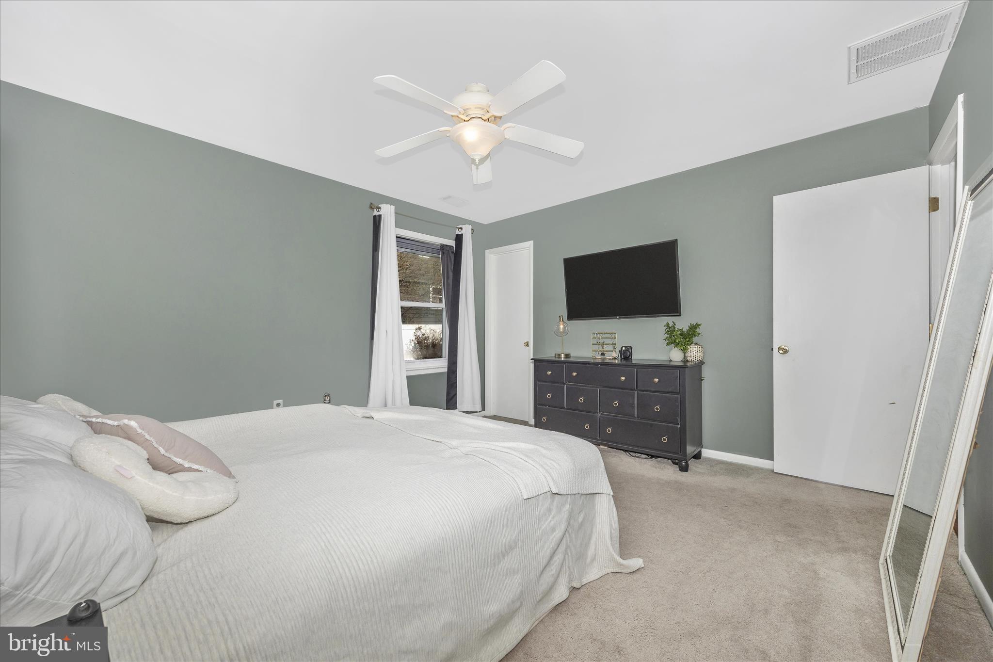 439 Center Street Frederick, MD 21701 - Photo 29 of 49 a bedroom with a bed and a flat screen tv