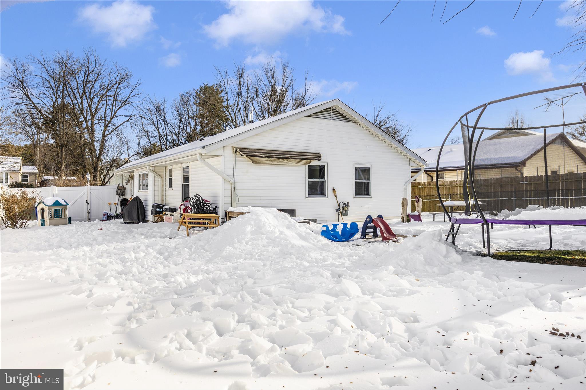 439 Center Street Frederick, MD 21701 - Photo 40 of 49 a view of a house with a yard covered in snow