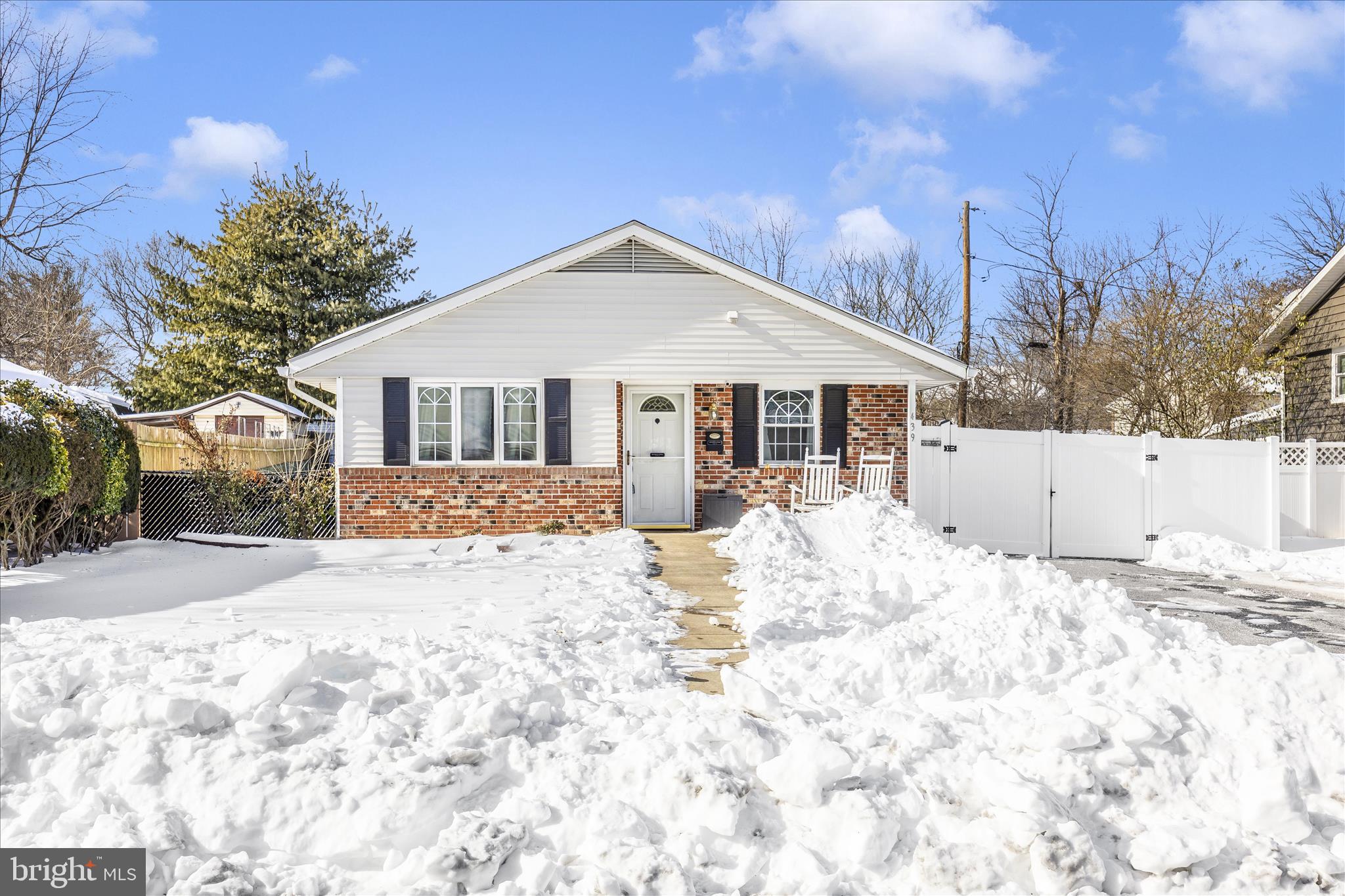 439 Center Street Frederick, MD 21701 - Photo 49 of 49 a front view of a house with a yard covered in snow
