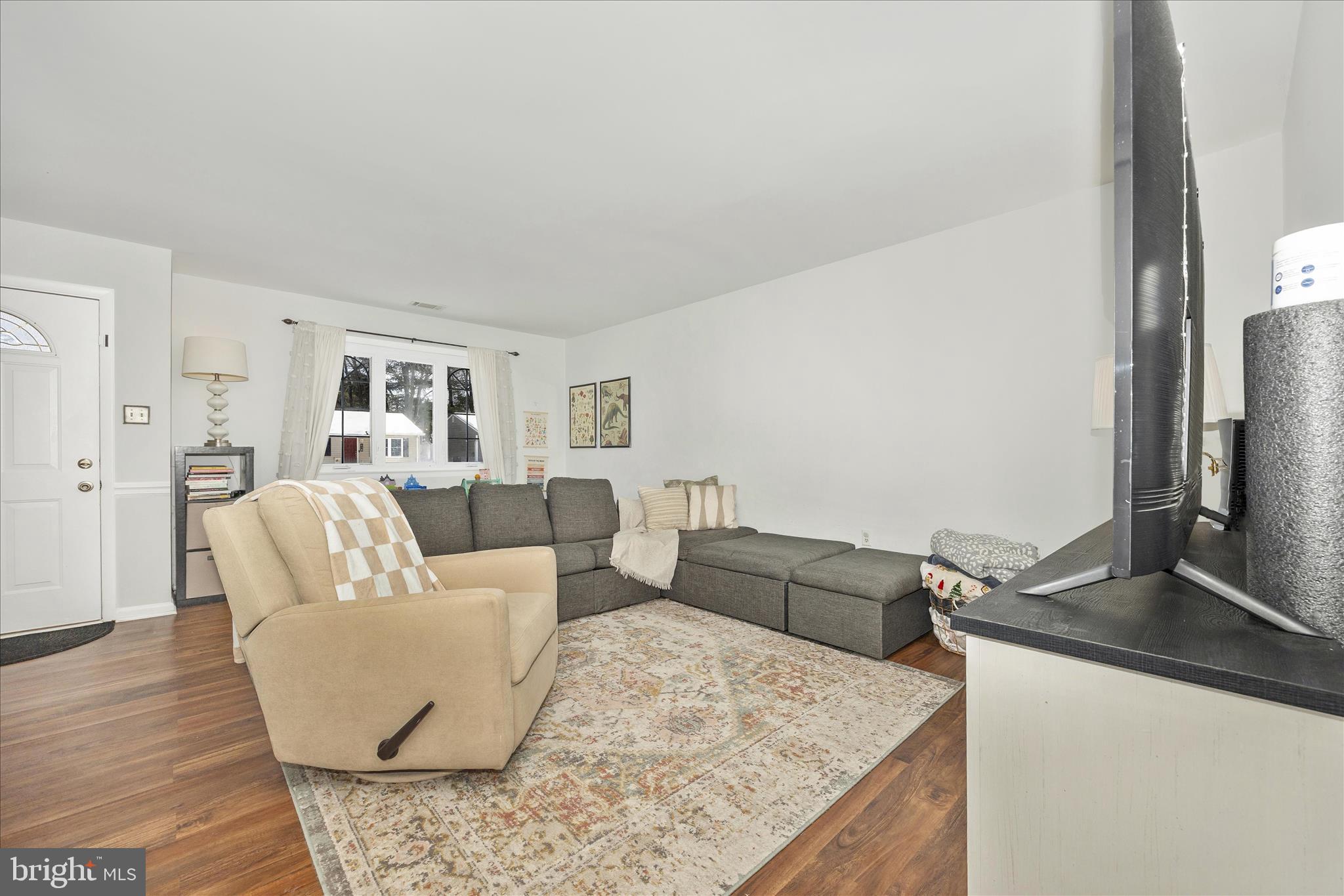 439 Center Street Frederick, MD 21701 - Photo 6 of 49 a living room with furniture and a flat screen tv
