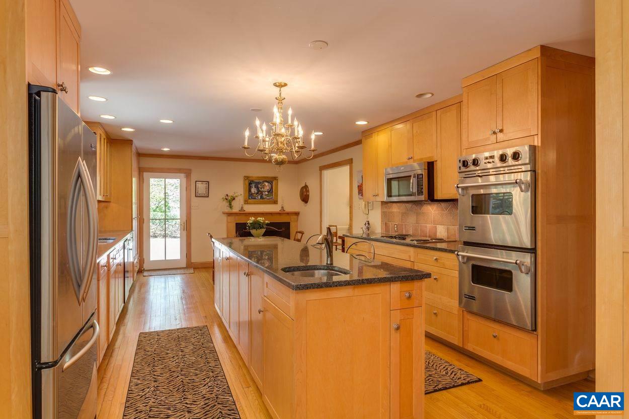 788 Tanglewood Road Charlottesville, VA 22901 - Photo 11 of 39 a kitchen with stainless steel appliances granite countertop a sink stove and refrigerator
