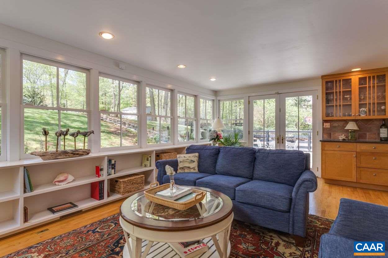 788 Tanglewood Road Charlottesville, VA 22901 - Photo 18 of 39 a living room with furniture and a large window
