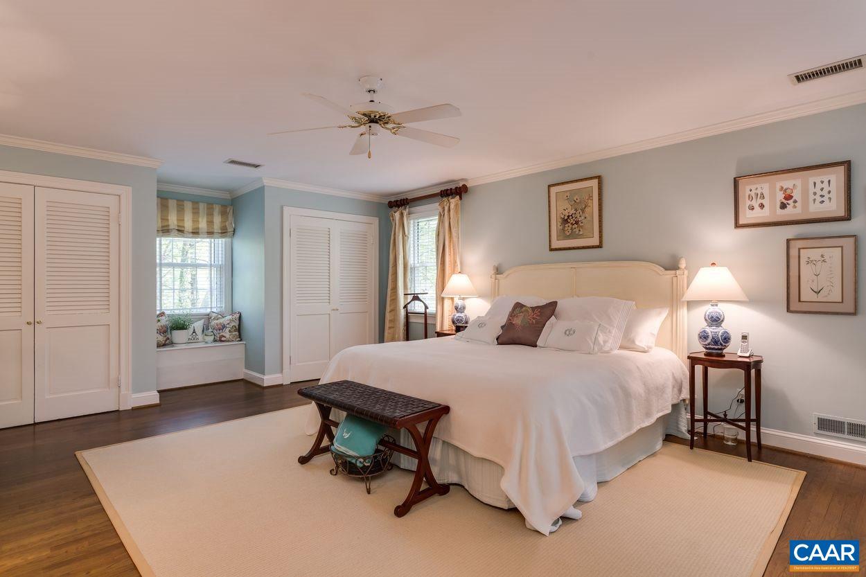 788 Tanglewood Road Charlottesville, VA 22901 - Photo 22 of 39 a bed room with a bed and a chandelier