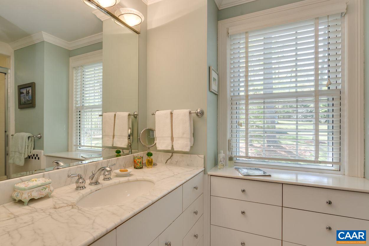788 Tanglewood Road Charlottesville, VA 22901 - Photo 23 of 39 a bathroom with a granite countertop sink and a large mirror
