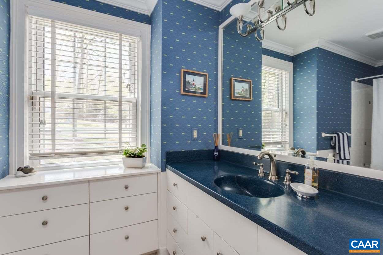 788 Tanglewood Road Charlottesville, VA 22901 - Photo 28 of 39 a view of a granite countertop kitchen with a sink and large window