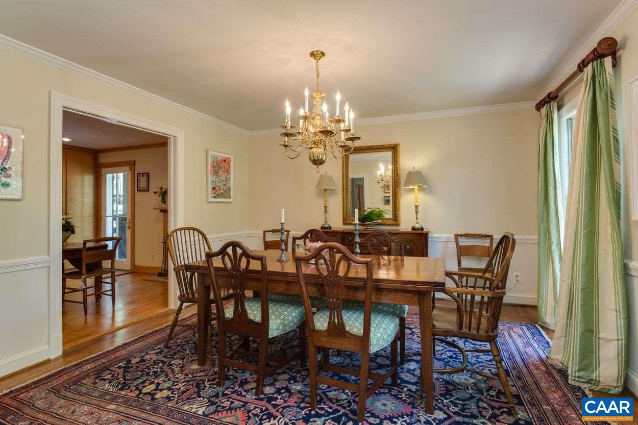 788 Tanglewood Road Charlottesville, VA 22901 - Photo 10 of 39 a view of a dining room with furniture and chandelier