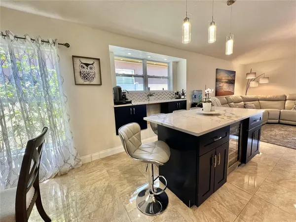 a kitchen with a sink and a refrigerator
