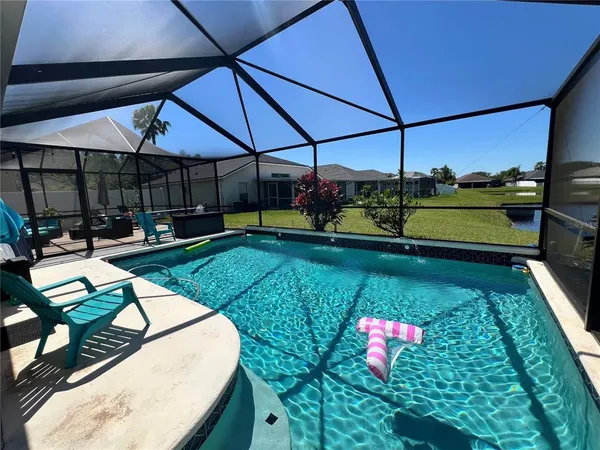 a view of a chairs and table in a patio