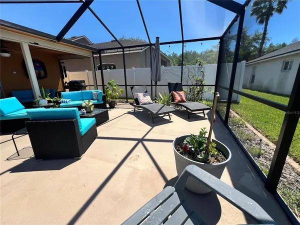 an aerial view of a house with swimming pool and garden