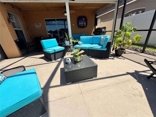 an aerial view of multiple houses with a yard