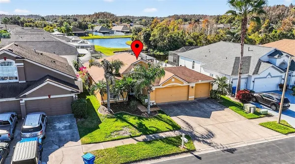 an aerial view of a house with a ocean view