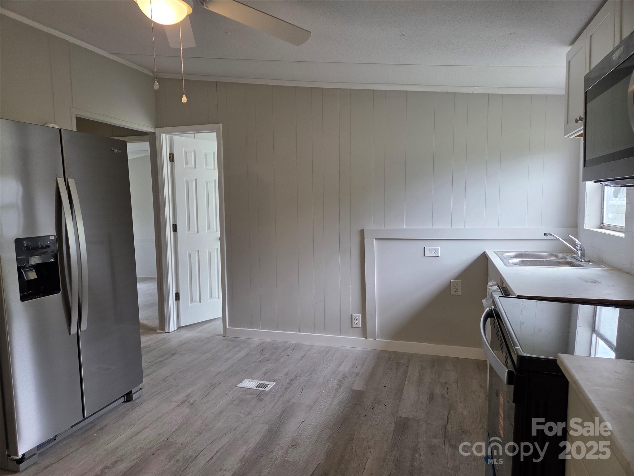 108 State Rd S-46-167 York, SC 29745 - Photo 13 of 19 a view of a kitchen with a refrigerator cabinets and wooden floor