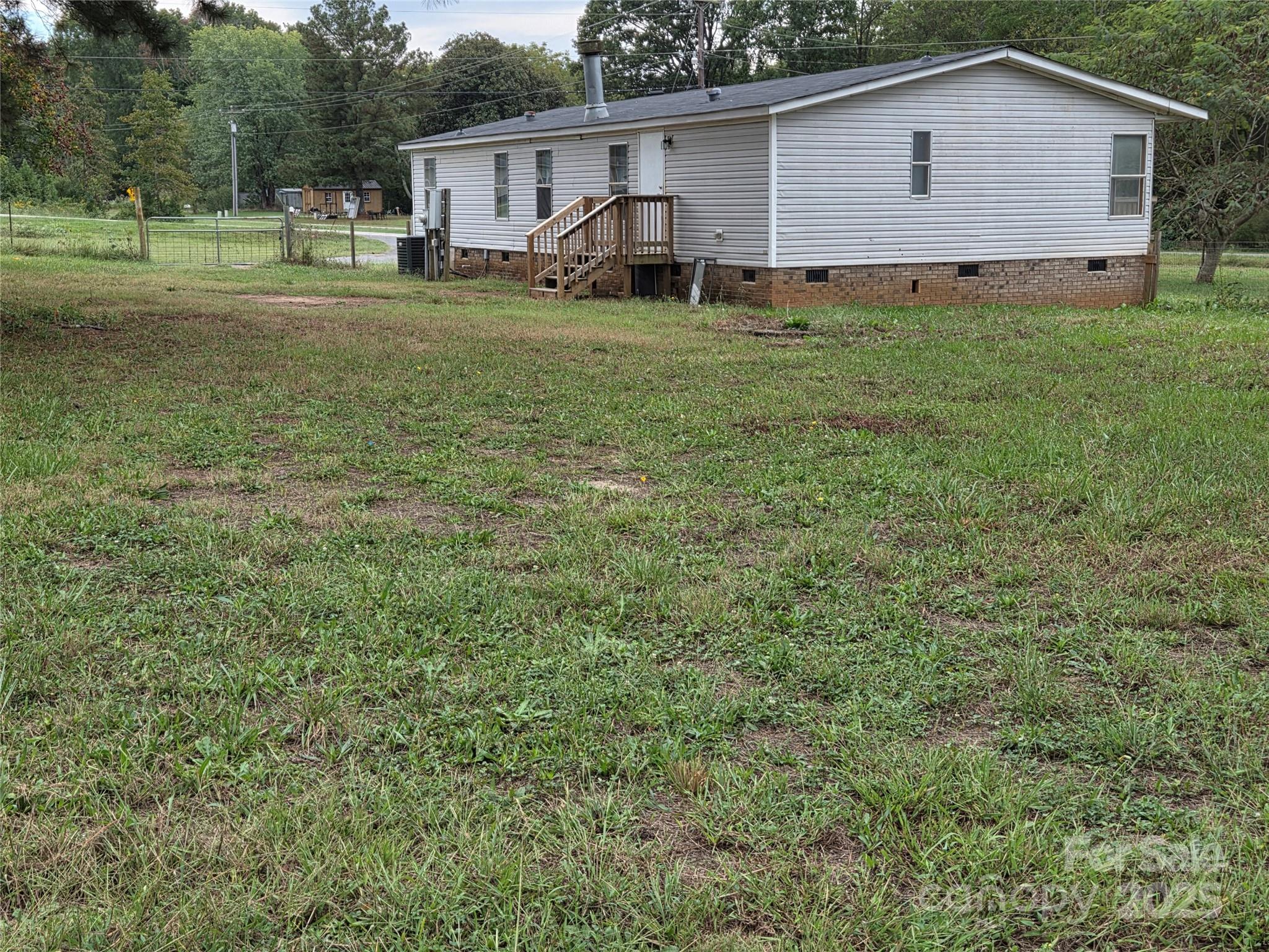 108 State Rd S-46-167 York, SC 29745 - Photo 19 of 19 a view of a house with a back yard