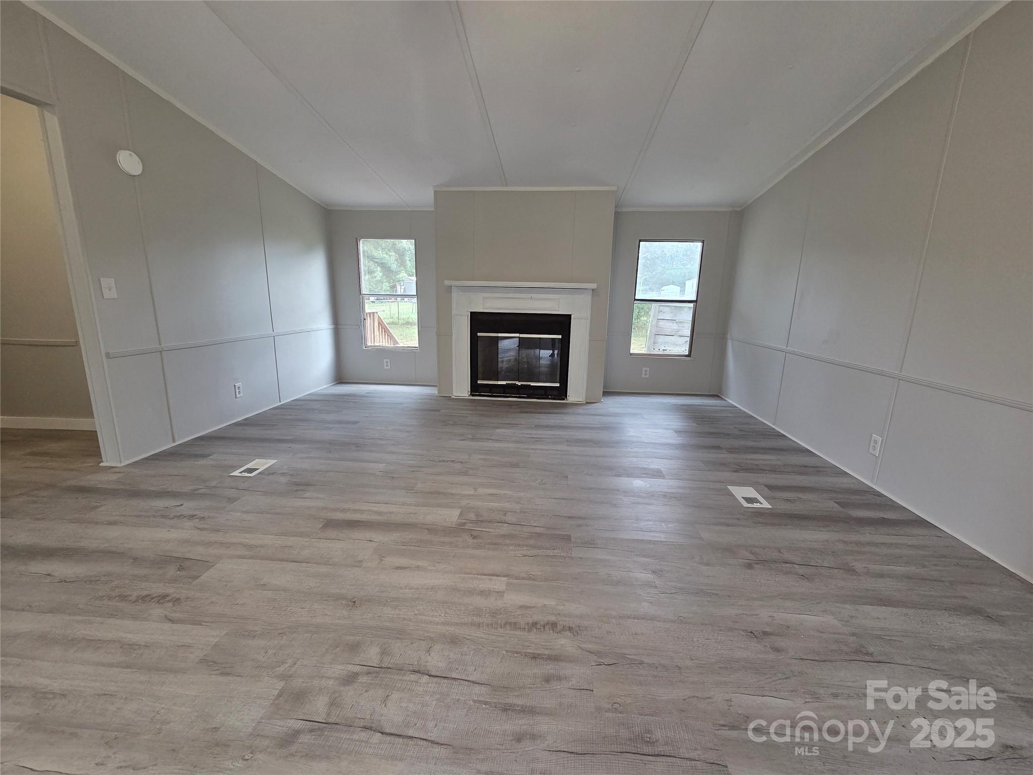108 State Rd S-46-167 York, SC 29745 - Photo 2 of 19 a view of an empty room with a fireplace and a window