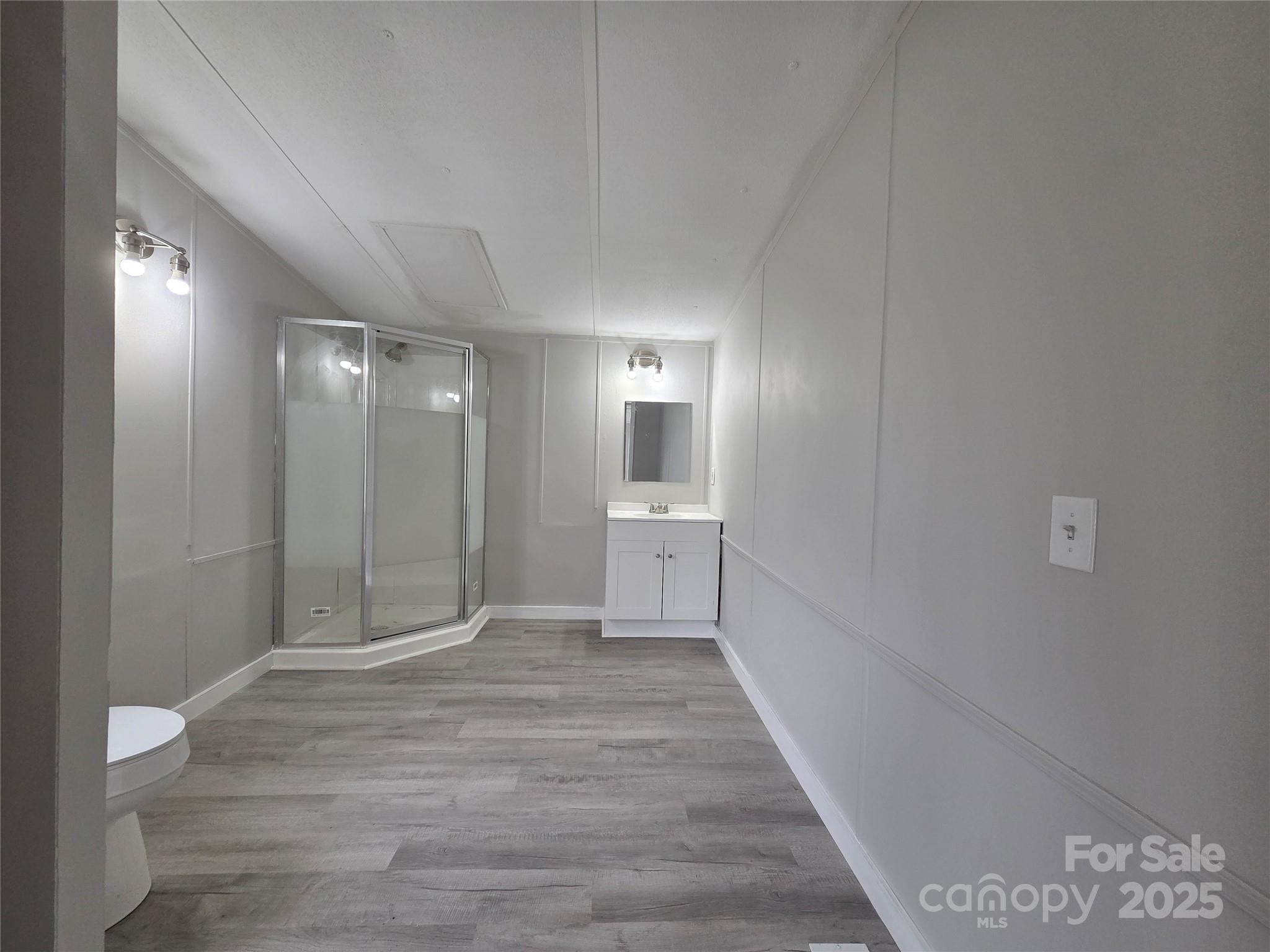 108 State Rd S-46-167 York, SC 29745 - Photo 9 of 19 a view of a hallway with wooden floor