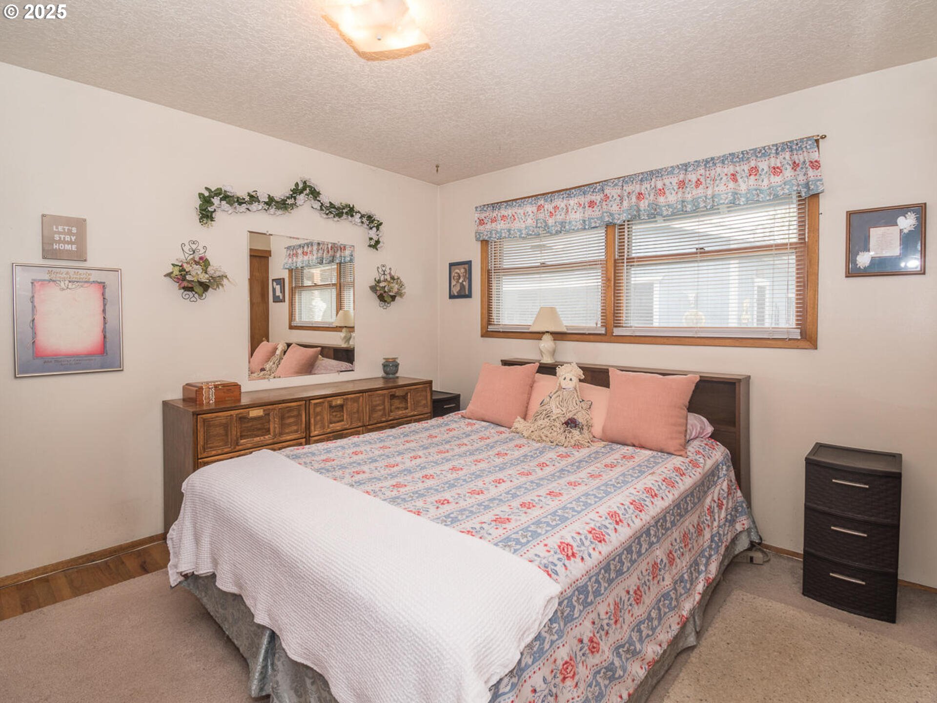 2068 Northeast Juniper Court Gresham, OR 97030 - Photo 23 of 42 a bedroom with a bed and a table