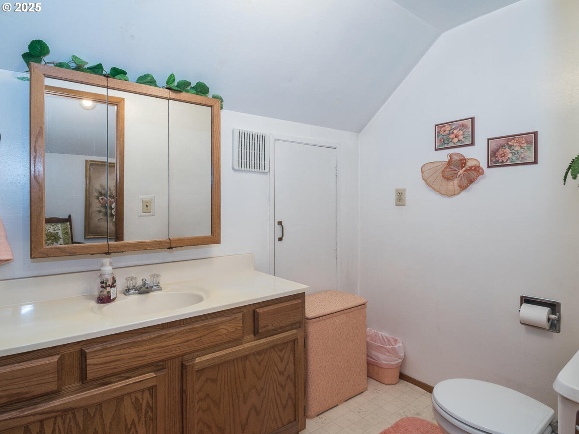 2068 Northeast Juniper Court Gresham, OR 97030 - Photo 26 of 42 a bathroom with a sink mirror vanity and toilet