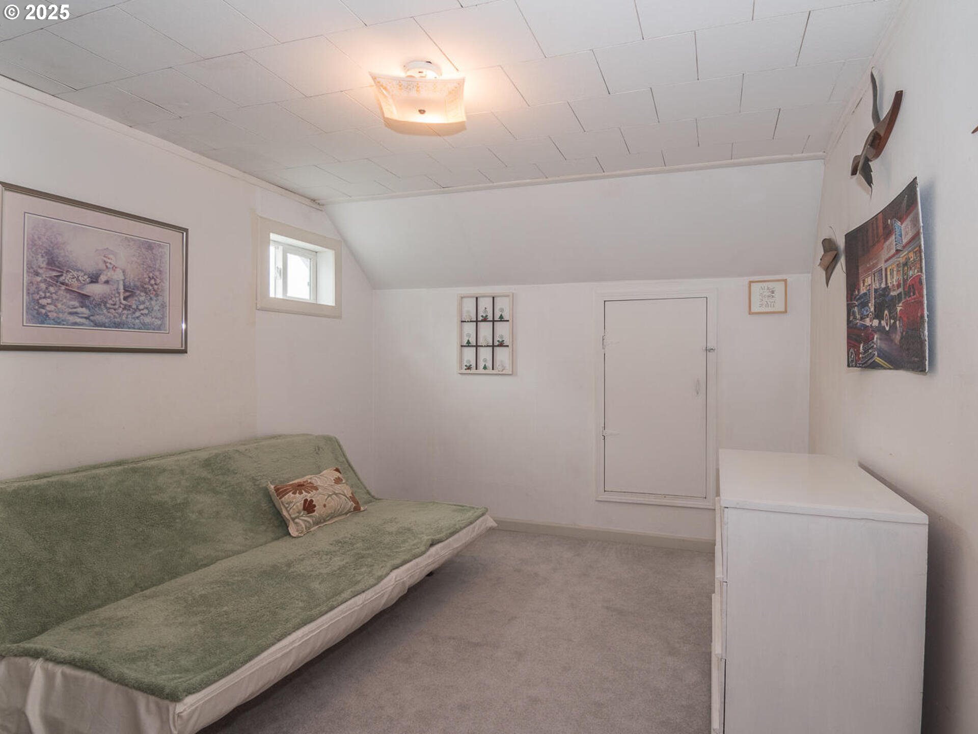 2068 Northeast Juniper Court Gresham, OR 97030 - Photo 27 of 42 a living room with furniture and a baby crib